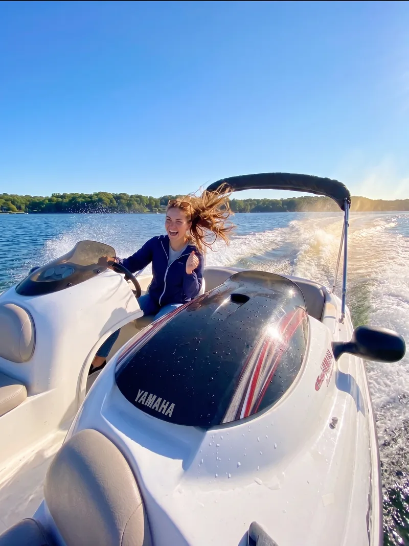 Woman driving a Yamaha jet boat on Long Island waters